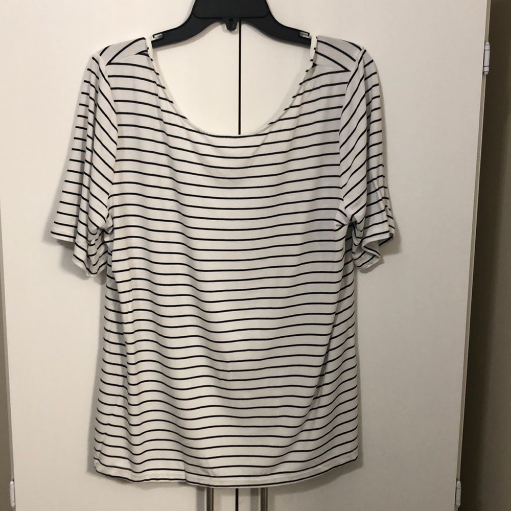 White top with black horizontal stripes